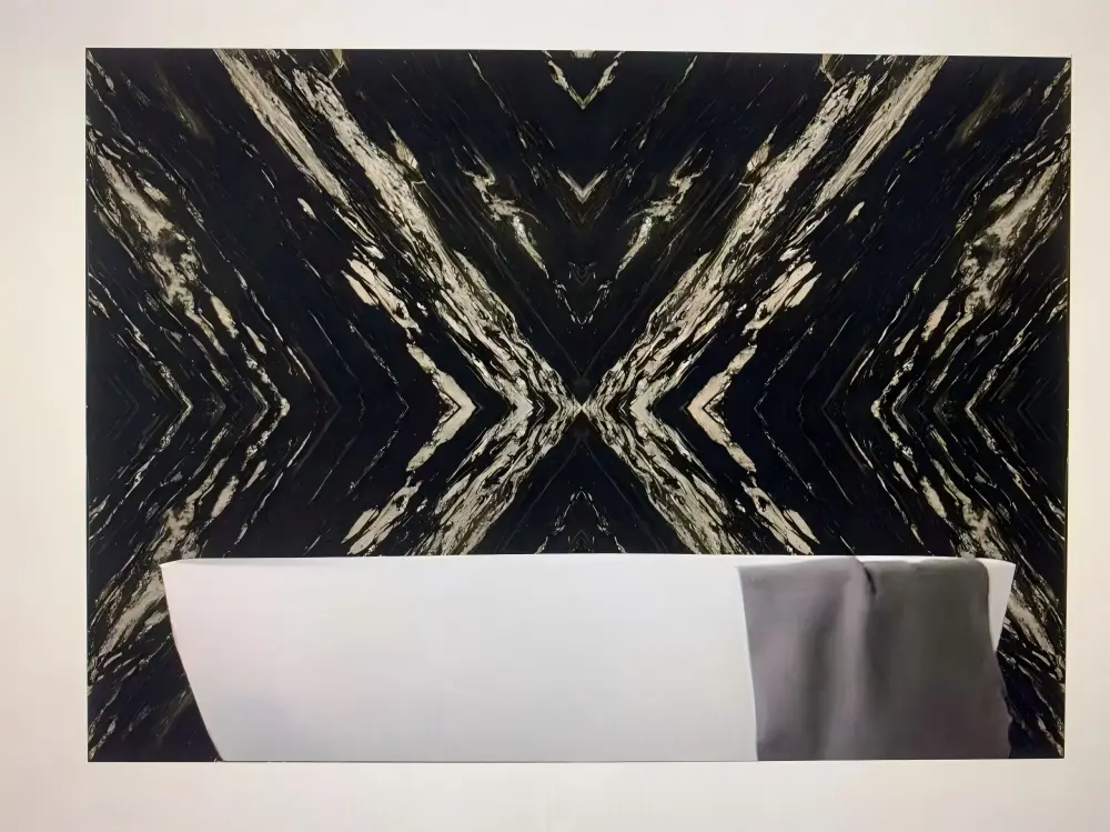 Black Titanium Granite Feature Wall Bookmatched Black Titanium Granite feature wall behind a sofa