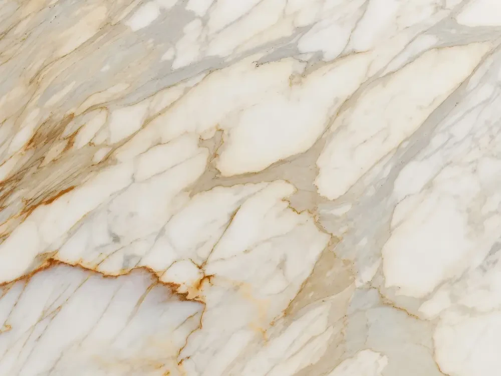 Calacatta Gold Marble warm white surface with gold beige veining detail